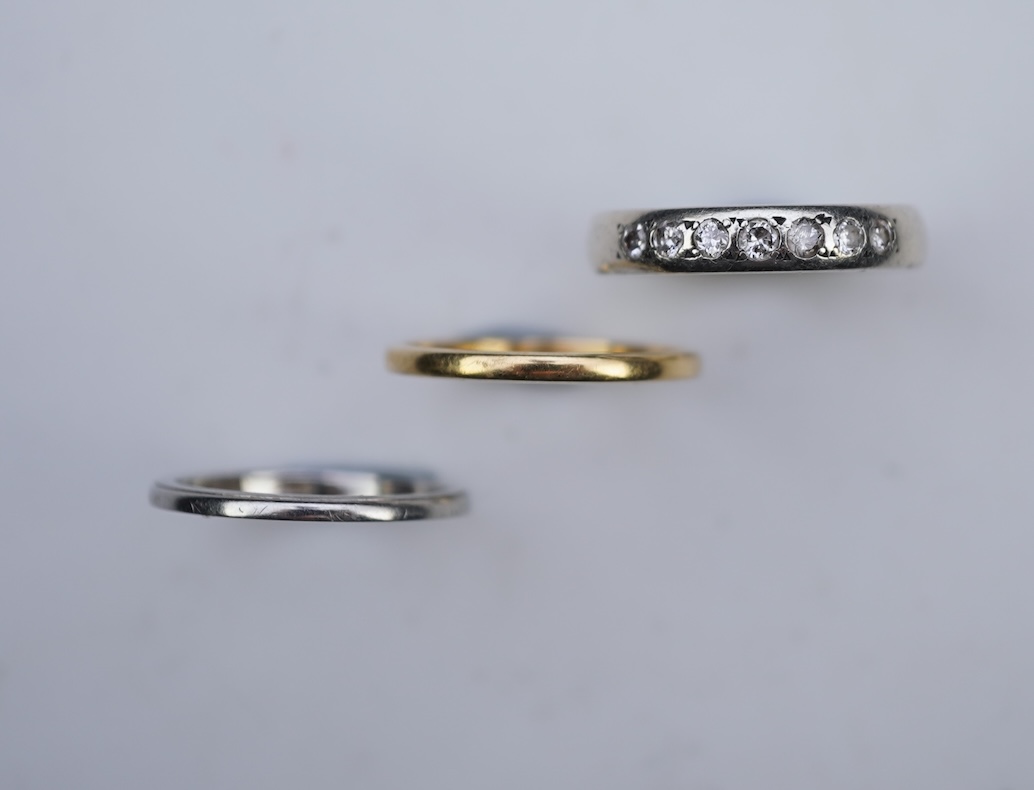 A diamond ring and two gold wedding rings